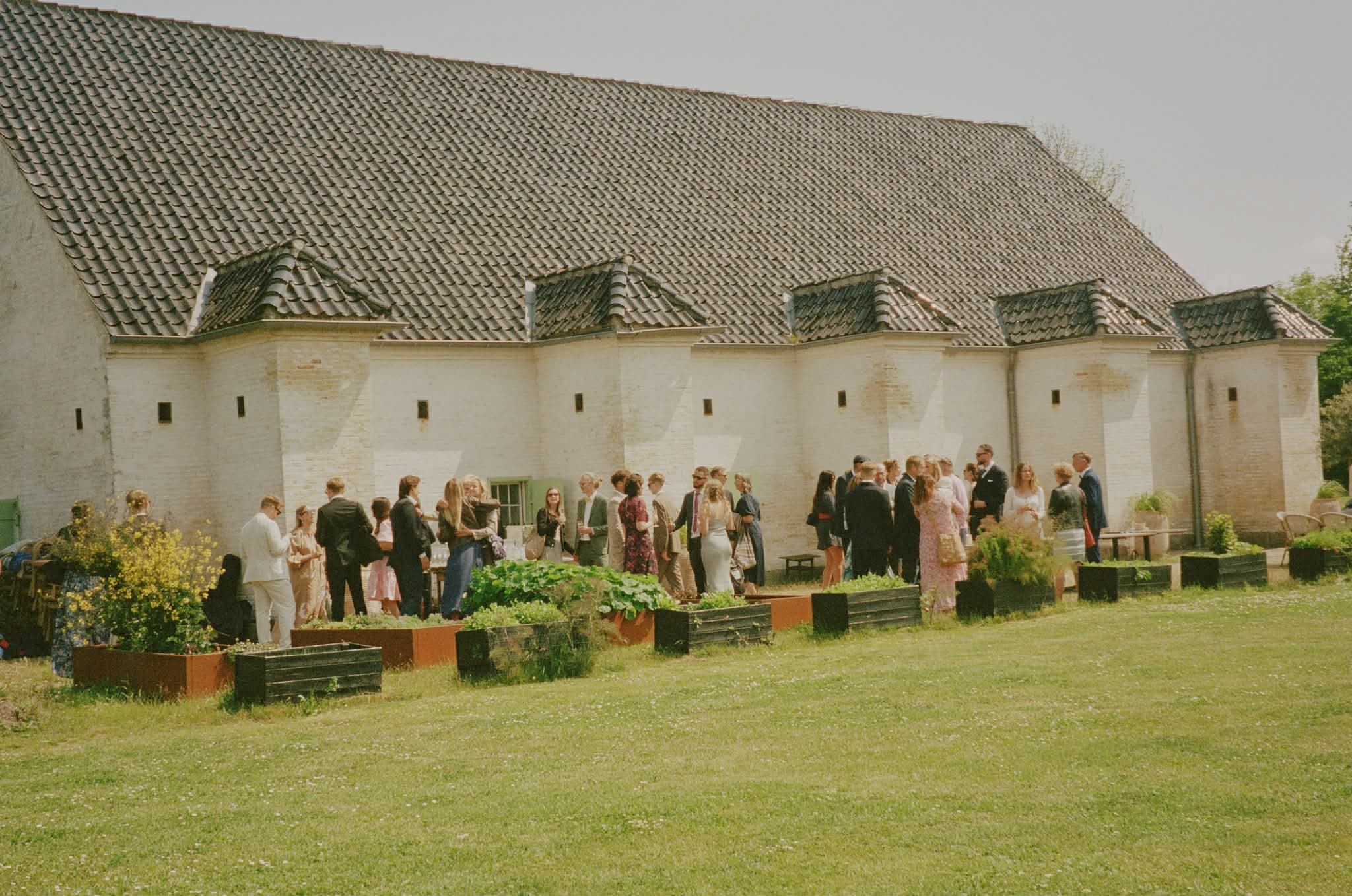 A celebration on the lawn beside the historic restaurant building