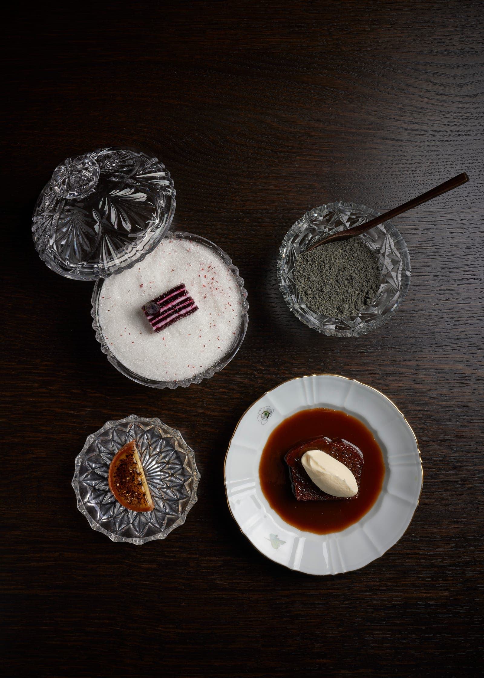 Petits fours and small sweets served in crystal and porcelain dishes